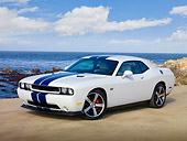 AUT 46 RK0028 01
2011 Dodge Challenger SRT8 White With Blue Stripe 3/4 Front View On Beach