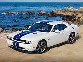 AUT 46 RK0029 01
2011 Dodge Challenger SRT8 White With Blue Stripe 3/4 Front View On Beach