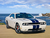 AUT 46 RK0030 01
2011 Dodge Challenger SRT8 White With Blue Stripe 3/4 Front View On Beach