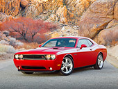 AUT 46 RK0079 01
2011 Dodge Challenger Red 3/4 Front View On Pavement By Tree And Red Rock