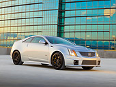 AUT 46 RK0088 01
2011 Cadillac CTS V Silver 3/4 Front View On Pavement By Glass Building