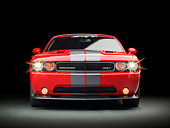 AUT 46 RK0133 01
2011 Dodge SRT8 Challenger Red With Gray Stripes Front View In Studio