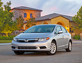 AUT 48 BK0001 01
2012 Honda Civic Silver 3/4 Front View On Pavement By House