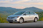 AUT 48 BK0003 01
2012 Honda Civic Silver 3/4 Side View On Pavement By Trees