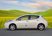 AUT 48 BK0007 01
2012 Nissan Leaf White Profile View On Pavement By Grassy Hills