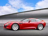 AUT 48 RK0037 01
2012 Alfa Romeo TZ3 Stradale Red Profile View On Pavement By Metal Structure