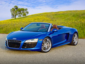 AUT 48 RK0073 01
2012 Audi R8 Spyder Blue 3/4 Front View On Pavement By Meadow