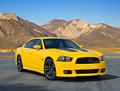 AUT 48 RK0082 01
2012 Dodge Charger SRT 8 Yellow 3/4 Front View On Pavement By Mountains