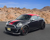 AUT 48 RK0085 01
2012 Mini John Cooper Works Black With Red Top 3/4 Front View On Pavement In Desert