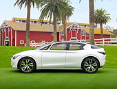 AUT 49 RK0001 01
2013 Infiniti Etherea White Profile View On Grass By Barn And Palm Trees
