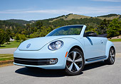 AUT 49 RK0010 01
2013 Volkswagen Beetle Covertible Turbo 60s Light Blue 3/4 Front View On Pavement By Hills