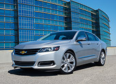 AUT 50 RK0005 01
2014 Chevrolet Impala Silver 3/4 Front View On Pavement By Glass Building
