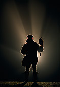 BRD 08 WF0001 01
Silhouette Of Falconer Holding A Harris Hawk At Night