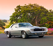 CAM 01 BK0003 01
1969 Chevrolet Camaro Z-28 RS Silver And Black Stripe 3/4 Front View On Pavement By Trees