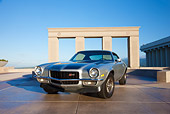 CAM 01 RK0191 01
1970 1/2 Chevrolet Camaro Z-28 Silver With Black Stripe 3/4 Front View On Pavement By Structure