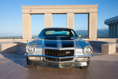 CAM 01 RK0193 01
1970 1/2 Chevrolet Camaro Z-28 Silver With Black Stripe Front View On Pavement By Structure