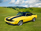 CAM 01 RK0217 01
1969 Chevrolet Camaro Z-28 Yellow With Black Stripes 3/4 Front View On Grassy Hills