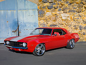 CAM 01 RK0230 01
1969 Chevrolet Camaro Z-28 Red With Gray Stripe 3/4 Front View On Pavement By Stone Wall