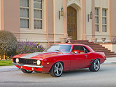 CAM 01 RK0235 01
1969 Chevrolet Camaro Z-28 Red With Gray Stripe 3/4 Front View On Pavement By Church