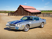 CAM 01 RK0237 01
1978 Chevrolet Camaro Z-28 Silver With Blue Stripe 3/4 Front View On Dirt Road By Barn