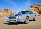 CAM 01 RK0240 01
1978 Chevrolet Camaro Z-28 Silver With Blue Stripe 3/4 Front View On Pavement By Rocks