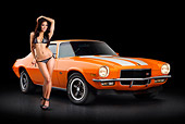 CAM 01 RK0278 01
1970 1/2 Chevrolet Camaro Z-28 Hugger Orange 3/4 Front View On Pavement With Swimsuit Model
