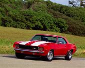CAM 01 RK0060 01
1969 Chevrolet Camaro Z-28 Red White Stripes 3/4 Front View On Pavement By Grass And Trees