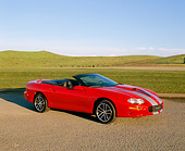 CAM 01 RK0080 03
2002 Chevy Camaro 35th Anniversary Convertible Red And Silver 3/4 Side View On Pavement By Grass Hills