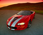 CAM 01 RK0084 01
2002 Chevy Camaro 35th Anniversary Convertible Red And Silver 3/4 Front View Wide Angle On Pavement By Grass Hill Filtered