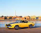 CAM 01 RK0098 03
1969 Camaro Z-28 Rally Sport Yellow Black Stripes 3/4 Side View On Pavement By Water At Dusk