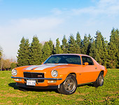 CAM 01 RK0163 01
1970 Chevrolet Camaro Z-28 Hugger Orange And White Stripe 3/4 Front View In Field
