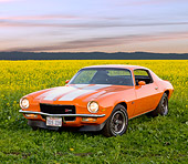 CAM 01 RK0168 01
1970 Chevrolet Camaro Z-28 Hugger Orange And White Stripe 3/4 Front View In Field Of Yellow Wildflowers