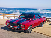 CAM 01 RK0173 01
1969 Chevrolet Camaro Z-28 Red With Black Stripe 3/4 Front View By Ocean