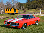 CAM 02 RK0181 01
1969 Chevrolet Camaro SS Red With White Stripes 3/4 Front View On Grass By Railroad