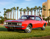 CAM 02 RK0184 01
1967 Chevrolet Camaro Red 3/4 Front View On Grass By Palm Trees And Building