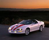 CAM 02 RK0019 02
1997 Chevrolet Camaro SS 30th Anniversary White Red Stripe 3/4 Front View On Pavement At Dusk