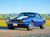 CAM 03 BK0001 01
1968 Chevrolet Camaro Blue With White Stripe 3/4 Front View On Road By Grassy Hills