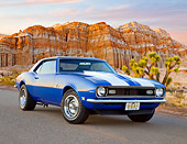 CAM 03 BK0003 01
1968 Chevrolet Camaro Blue With White Stripe 3/4 Front View On Pavement By Red Rock