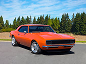 CAM 03 RK0210 01
1968 Chevrolet Camaro Orange 3/4 Front View On Pavement By Pine Trees