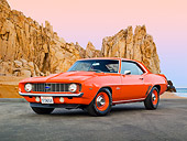 CAM 03 RK0220 01
1969 Chevrolet COPO Camaro Orange 3/4 Front View On Pavement By Red Rock By Beach At Dusk