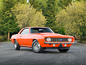 CAM 03 RK0228 01
1969 Chevrolet Camaro ZL-1 Orange 3/4 Front View On Pavement By Trees