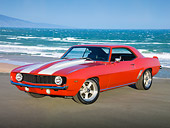 CAM 03 RK0245 01
1969 Chevrolet Camaro Red With White Stripes 3/4 Front View On Pavement By Beach
