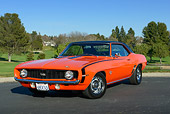 CAM 03 RK0264 01
1969 Chevrolet Camaro SS Orange With Black Top 3/4 Front View On Pavement By Golf Course
