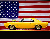 CAM 03 RK0005 05
1969 Chevrolet Camaro Street Rod Yellow Profile American Flag Background Studio