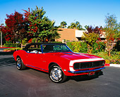 CAM 03 RK0064 06
1968 Chevrolet Camaro RS Convertible Red White Stripe Low 3/4 Front View On Pavement By Trees