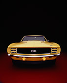 CAM 03 RK0114 08
1969 Chevrolet Camaro RS C.O.P.O Yellow Wide Angle Head On Shot Red Floor Studio
