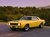 CAM 03 RK0131 01
1969 Chevrolet Yenko Camaro Daytona Yellow And Black Side 3/4 View On Pavement By Trees