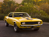 CAM 03 RK0132 01
1969 Chevrolet Yenko Camaro Daytona Yellow And Black Front 3/4 View On Pavement By Trees