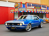CAM 03 RK0163 01
1968 Chevrolet Camaro SS LeMans Blue 3/4 Front View On Pavement By Building