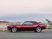 CAM 03 RK0203 01
1967 Chevrolet Camaro Burgundy Profile View On Pavement At Marina